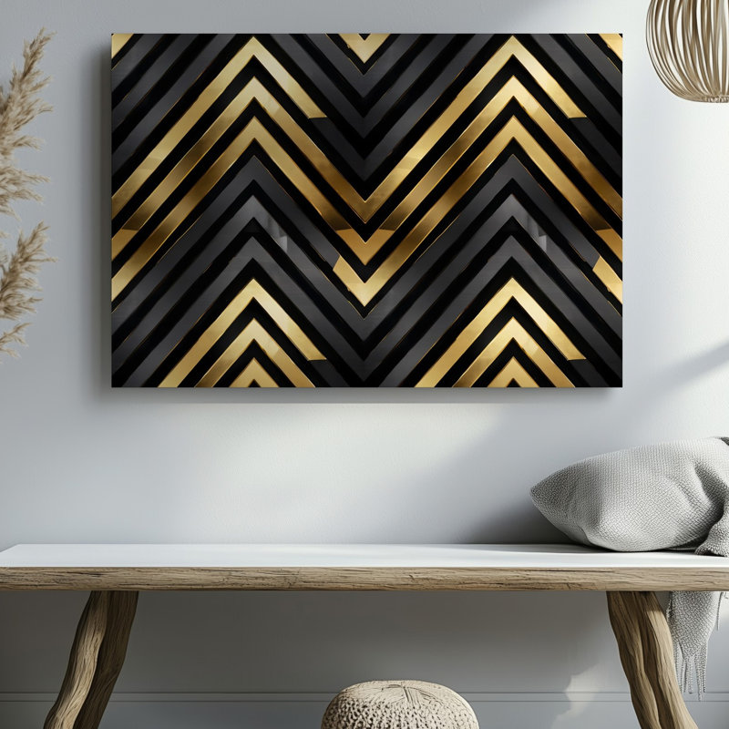 Toile d'un motif géométrique sophistiqué avec des formes de chevrons audacieux dans un art mural frappant noir et doré