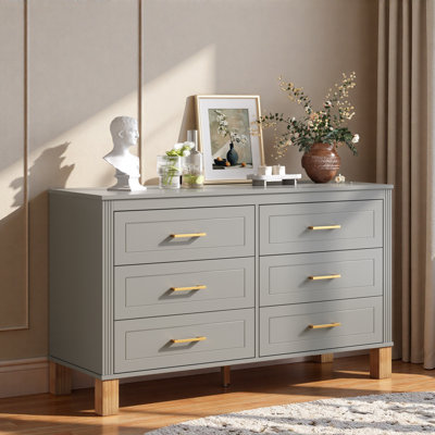 Commode moderne avec 6 tiroirs, poignées en métal et pieds en bois