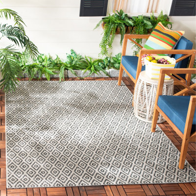Tapis bleu marine intérieur / extérieur Arneshia Southwestern