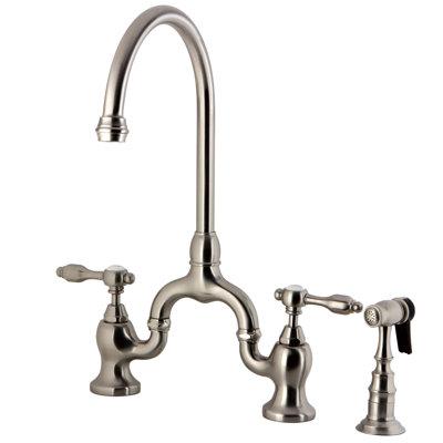 Kingston Brass Tudor Two-Handle 3-Hole Deck Mount Bridge Kitchen Faucet with Brass Side Sprayer