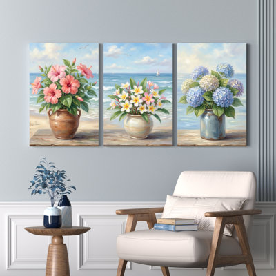 Ensemble de 3 tableaux sur toile tendue représentant un bouquet de fleurs et une scène de plage