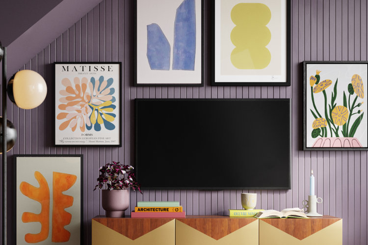 gallery of wall art around a wall-mounted tv