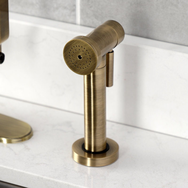 Kingston Brass Whitaker Single-Handle Deck Mount Kitchen Faucet with Brass Sprayer, Antique Brass