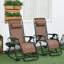 Ensemble de 2 chaises berçantes d'extérieur, chaise berçante inclinable et pliable inclinable avec oreiller, porte-gobelet et téléphone, conception combinée avec pieds pliants (chaise berçante)