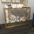 Beritan Metal Weathered Geometric Gold Console Table with Mirrored Glass Top
