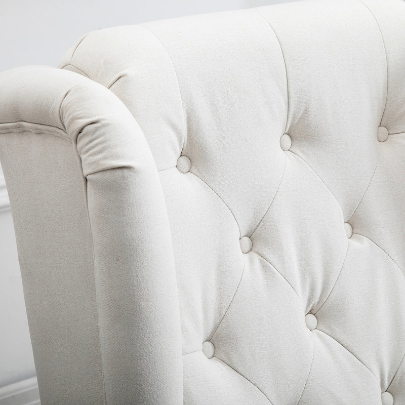 Fauteuil d'appoint blanc crème avec tissu respirant, pour une touche de fraîcheur. Fauteuil à boutons. Design élégant. Haut dossier à oreilles et assise rembourrée. Assise épaisse et rembourrée. Convient au salon, à la chambre et au bureau. Bois massif et eucalyptus.