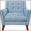 Fauteuil de style Mid-Century moderne avec pieds évasés et revêtement capitonné, parfait pour des sièges élégants et confortables dans tout espace de détente.-252555259