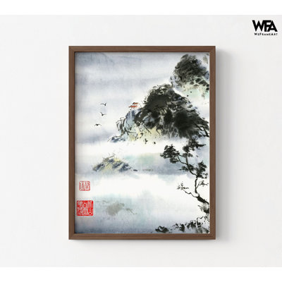 Framed wall art featuring an ink wash landscape painting of misty mountains, a small building, and birds in a dark wood frame.
