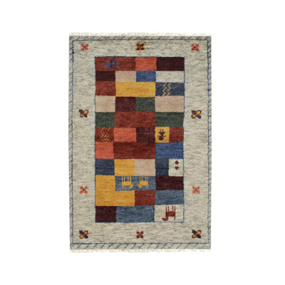 Tapis beige en laine noué à la main à motif géométrique traditionnel