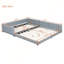 Grand lit plateforme tapissier en similicuir
