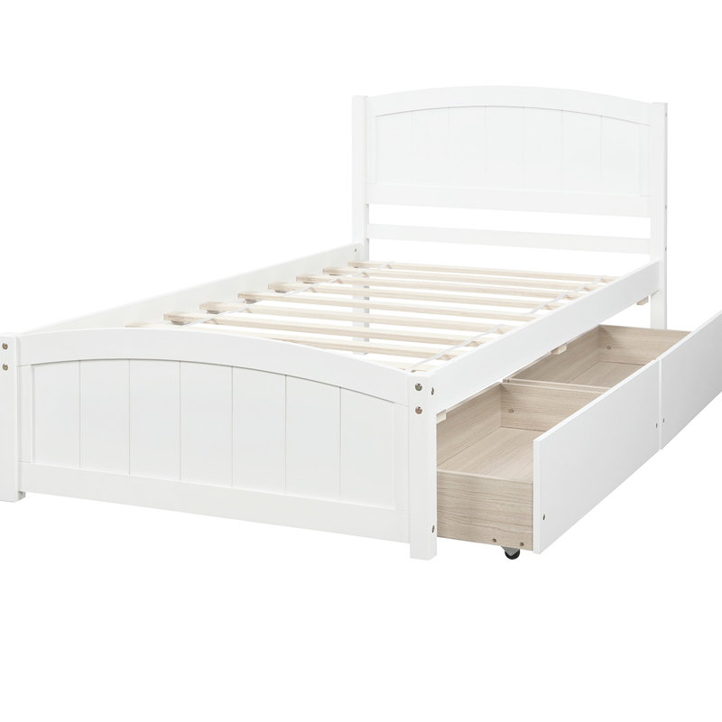 Lit simple blanc avec deux supports de tiroir en bois massif pour une structure de chambre à coucher stable