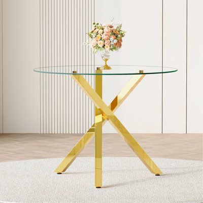Table ronde en verre pour 2 à 4 personnes: diamètre de 39 pouces, hauteur de 30 pouces, structure en métal doré en forme de X, idéale pour les restaurants, les cuisines et les petits espaces, élégante et pratique.