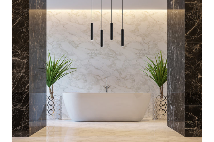 beautiful modern bathroom with black marble tile and a white bath with LED lighting hanging above it
