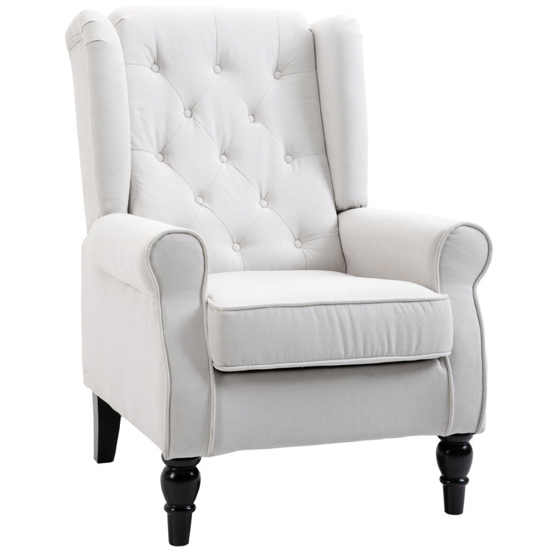 Fauteuil d'appoint capitonné à boutons avec haut dossier à oreilles, accoudoirs rembourrés arrondis et siège rembourré épais