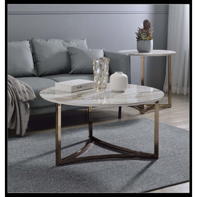 Table basse Aziz avec plateau en pierre frittée et finition champagne