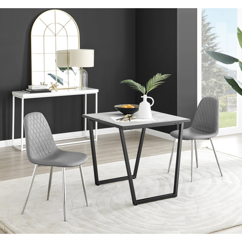 Table de salle à manger et chaises en mélamine effet marbre Carzon - Chaises de salle à manger en similicuir de luxe