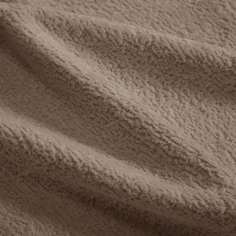 Canapé d'angle en chenille nuage avec pouf amovible et finitions à pompons