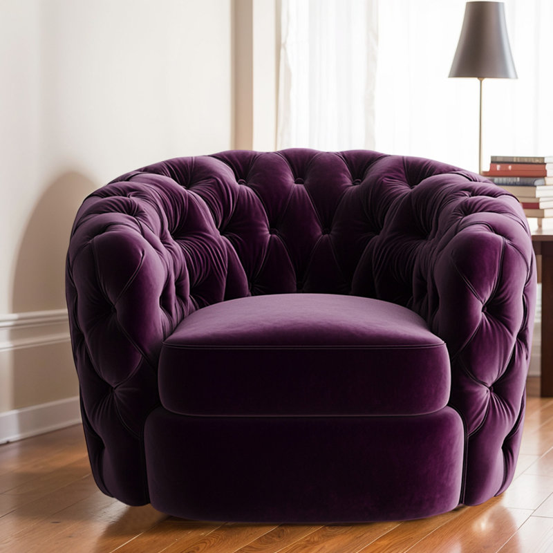 Fauteuil capitonné en velours mauve foncé