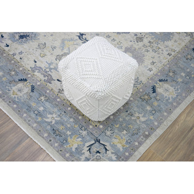 Woolhorpe Upholstered Pouf