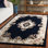 Tapis ivoire / bleu marine en laine / coton touffeté à la main Steller Aubusson