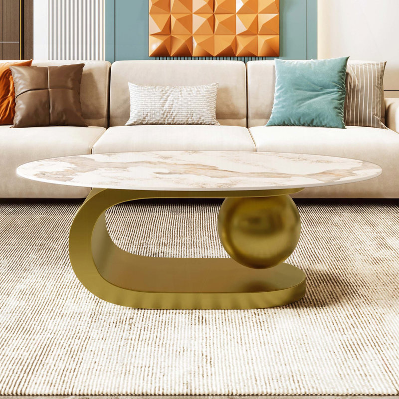 Table basse ovale avec plateau en pierre frittée à motif marbré et base en acier inoxydable doré - 47,2 po