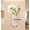 Décoration murale en grès crème avec vase d'eau et verdure