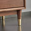 Commode d'appoint simplifiée en forme de trapèze incliné en laiton