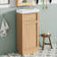 Meuble-lavabo de 15,75 po avec lavabo réversible en résine, armoire en panneau de fibres à densité moyenne avec tablette réglable et porte à pousser, finition en mélamine grain de bois, porte réversible, style rustique pour petits espaces