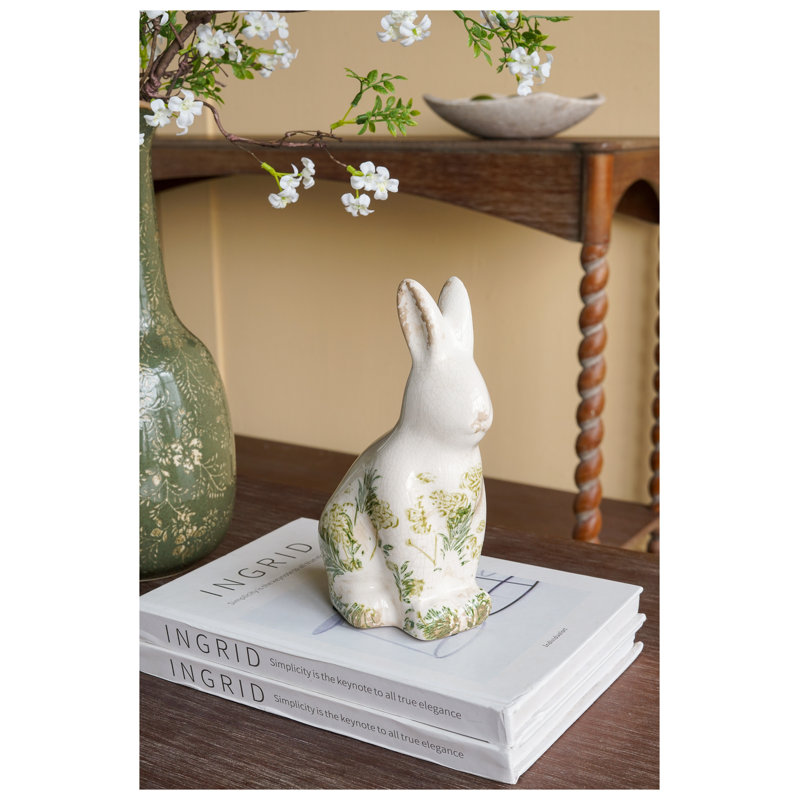 Figurine de lapin blanc en céramique avec motif floral vert