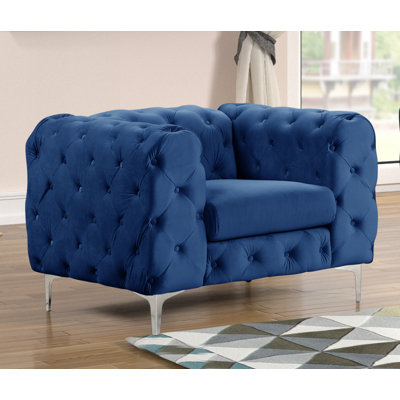Fauteuil en velours capitonné Bernie
