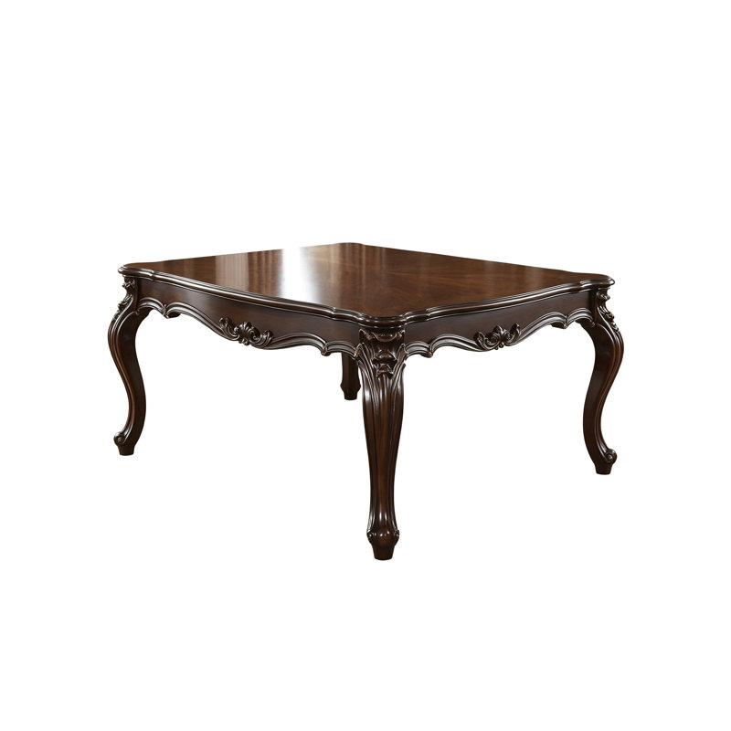 Table de salle à manger ronde de 140 cm (55 po) avec dessus en pierre frittée et piètement sculpté en chêne.