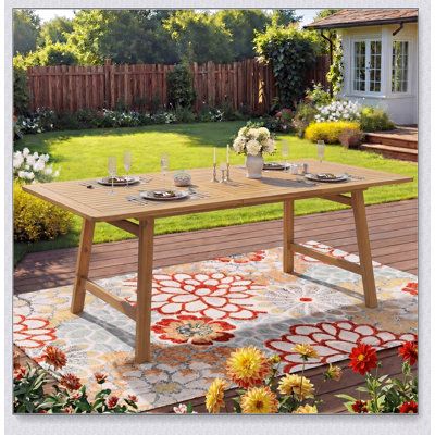 Table de salle à manger d'extérieur extensible en bois d'acacia avec plateau à lattes résistant aux intempéries pour des réceptions polyvalentes sur la terrasse.