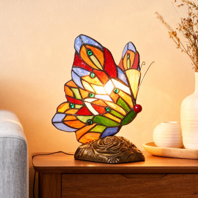 Tiffany-style butterfly stained glass table lamp with a resin base sold new by a US retailer in 2026