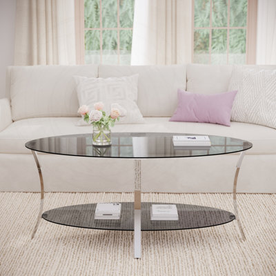 Table basse moderne en verre ovale, verre trempé et structure en métal argenté