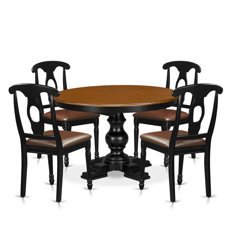 L'ensemble de table de salle à manger 5 pièces se compose d'une table de cuisine avec rallonge et pieds piédestal, 4 chaises de cuisine en cuir PU, dossier Napoléon, noir