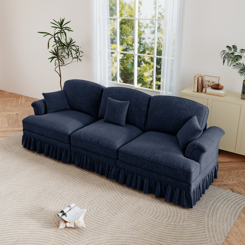 Causeuse rembourrée Mid-Century, canapé trois places avec accoudoirs évasés et jupes plissées à volants, Bleu