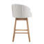 Tabouret de bar Elara pivotant à 360°, hauteur du siège 82 cm, revêtement capitonné, structure en hévéa massif, dossier capitonné.