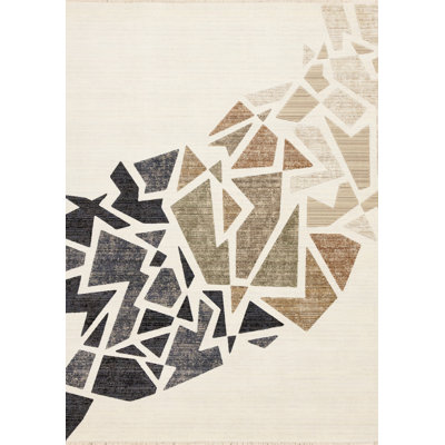 5' X 8' Cream Black And Tan Abstract Area Rug
