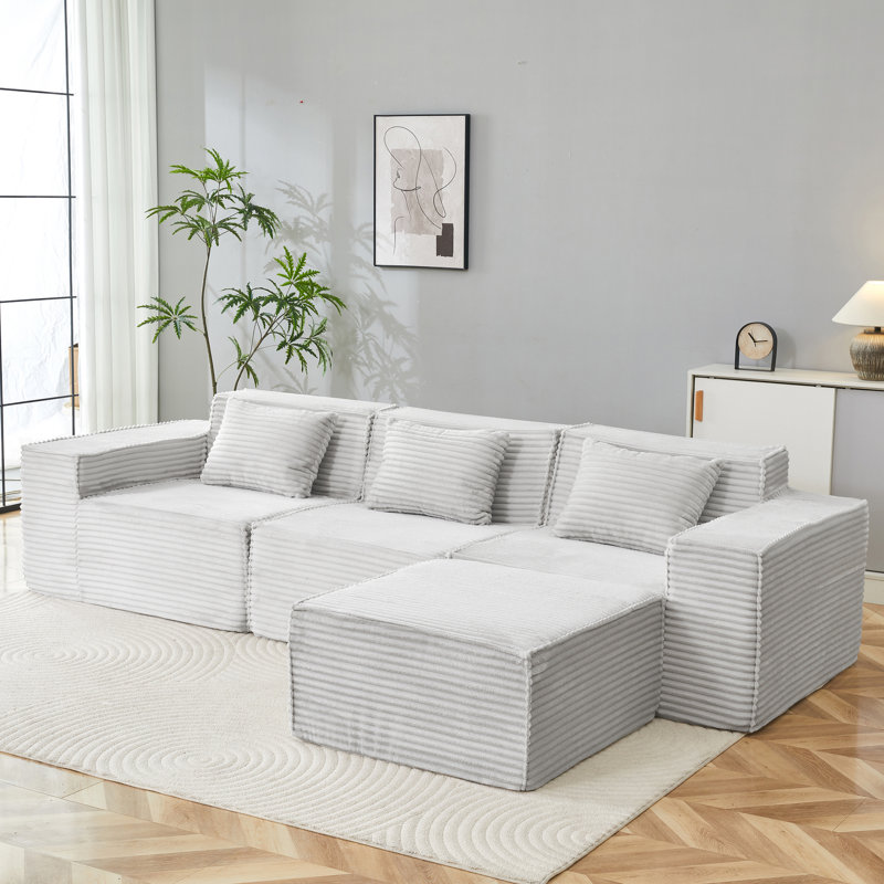 Canapé modulaire spacieux avec repose-pieds, tissu en velours côtelé, usage domestique moderne