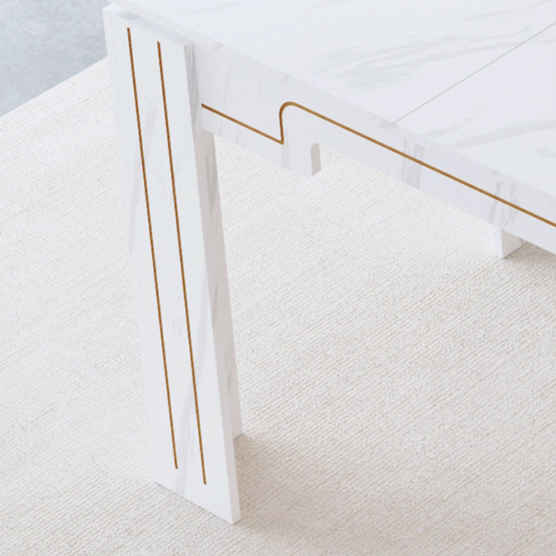 Table de salle à manger minimaliste en marbre blanc avec pieds rainurés pouvant accueillir de six à huit personnes