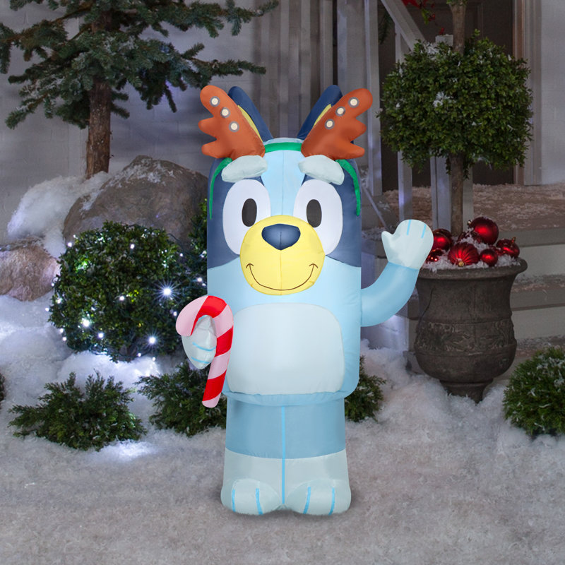 Bluey Airblown avec des bois tenant une canne en sucre