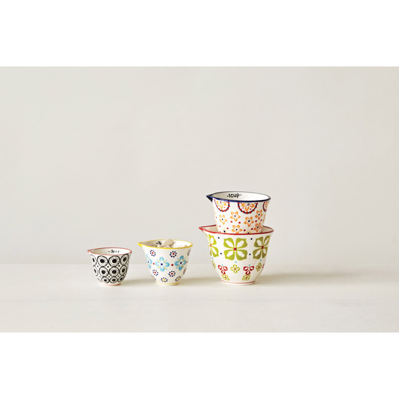 4‑Piece Hand‑Stamped Stoneware Measuring Cups with Floral Patterns