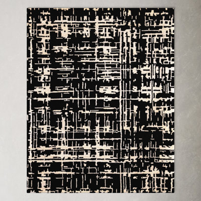 Brannon Abstract Handmade Tufted Black Area Rug