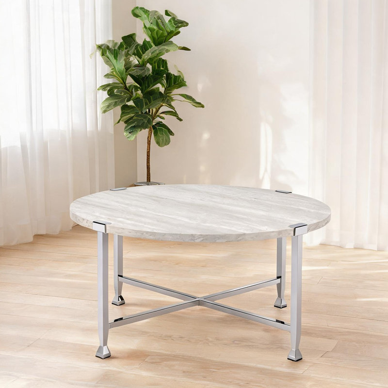 Table basse avec plateau rond blanc pur et structure en métal chromé, conception ouverte de 36 pouces
