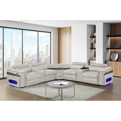 Canapé modulaire avec 2 consoles de lecture + réfrigérateur, barre de divertissement, haut-parleurs et commandes, alimentation électrique, appuis-tête réglables manuellement, coussin de recharge sans fil, ports, console de congélateur optionnelle b