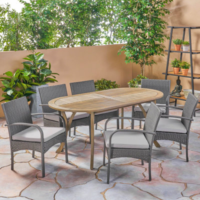 Lecuyer 6 - Person Acacia Wicker Patio Dining Set with Oval Table , Cushions Included