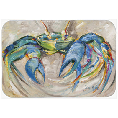 Crabe en planche à découper en verre sur fond beige
