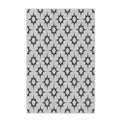 Tapis vert/orange à motifs