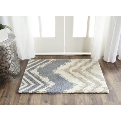 Tapis bleu / ivoire en laine touffeté à la main Simryn