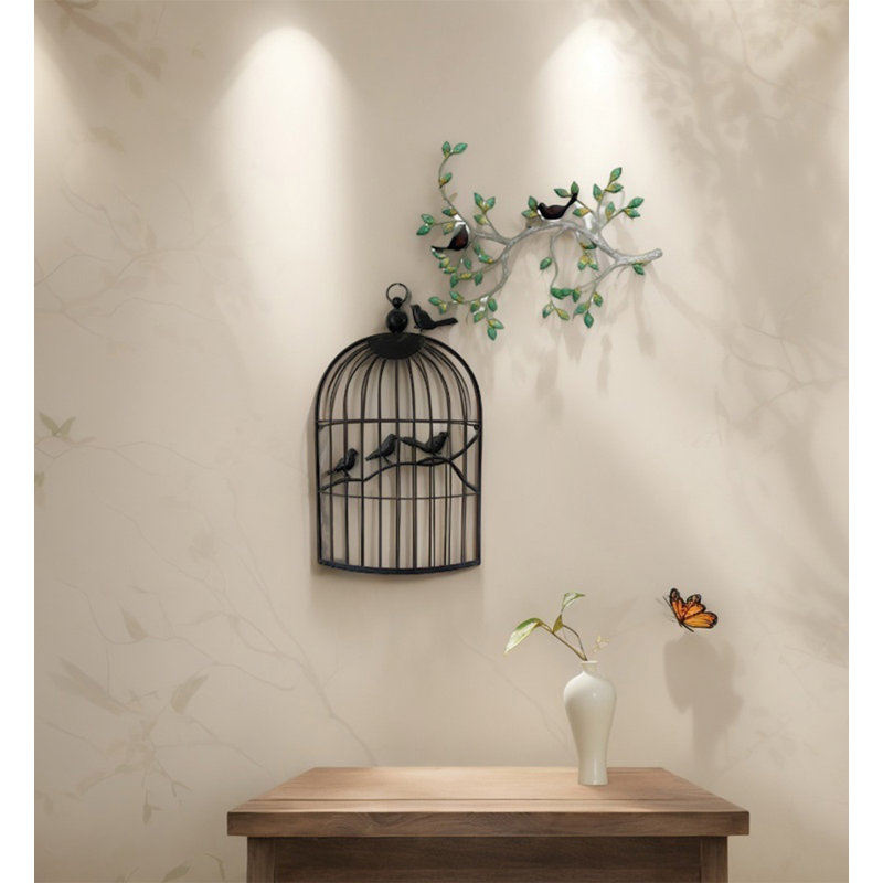 Décoration murale vintage en métal représentant un oiseau en forme de branche et de cage à oiseaux, idéale pour le salon ou la maison.